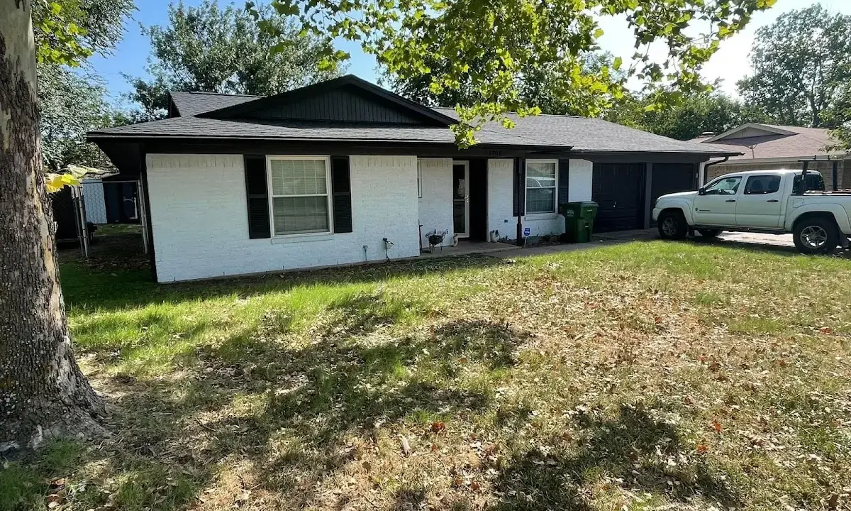 Professional roofing crew working on a residential roof in Wilkes-Barre